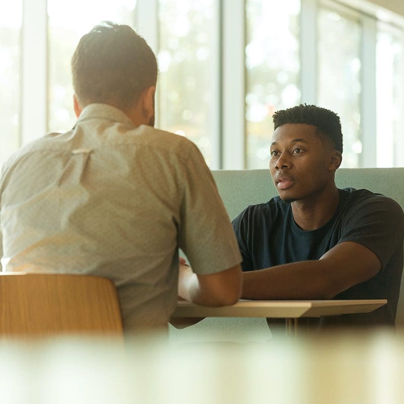 teenager talking to adult about depression